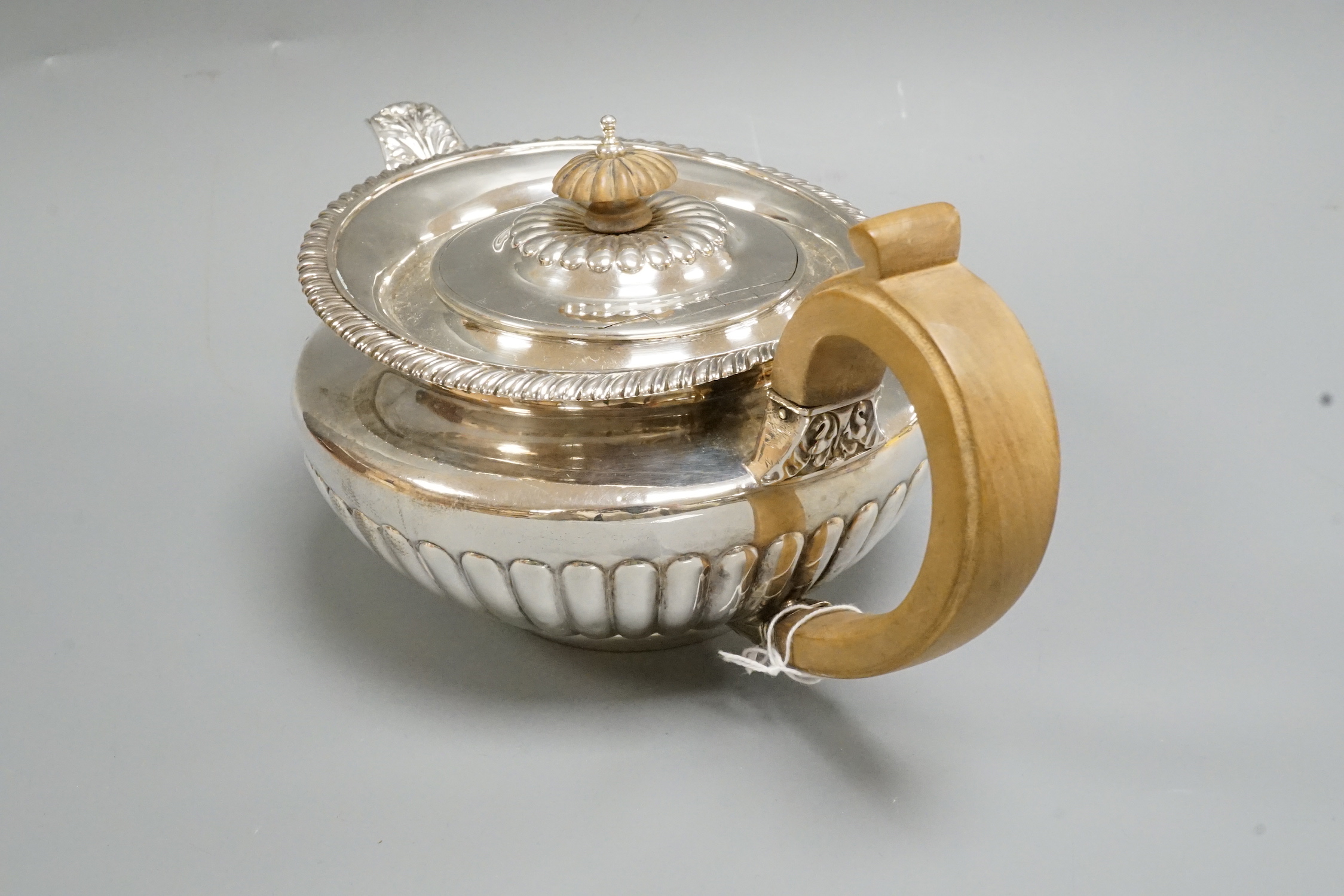 A George IV demi fluted silver teapot, Emes & Barnard, London, 1824, gross weight 20.6oz.